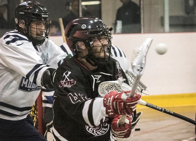 LET LOOSE – Brett Baron of the St. Albert Miners releases a pass while slashed in Sunday's 14-8 win over the Calgary Mountaineers in game two of the best-of-five Rocky Mountain Lacrosse League provincial final at Strathcona Olympiette Centre. The three-time defending President's Cup senior B national champions opened the series with Saturday's 8-5 decision against the visiting Mountaineers. 
DAN RIEDLHUBER/St. Albert Gazette