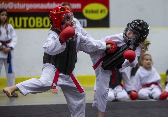 COMBATANTS – Evelyn Brown, left, and Annika Harris exchange strikes and kicks in the red belt female 6 to 8 sparring division at the 21st annual Spirit of the North, hosted by the Desa School of Karate at Servus Credit Union Place. The two-day event featured 280 competitors and 89 divisions in kata, kumite (sparring) and kobudo (weapons training) for ages six to adult from white belts to black belts.
CHRIS COLBOURNE/St. Albert Gazette