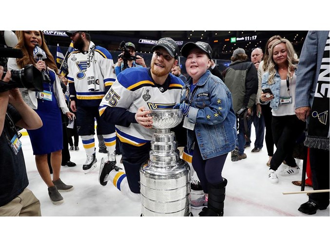 CHAMPIONS – Colton Parayko of St. Albert and St. Louis Blues' superfan Laila Anderson pose with the Stanley Cup on Wednesday at TD Garden in Boston. Anderson, 11, has hemophagocytic lymphohistiocytosis, a sever systemic inflammatory syndrome, and was flown to Game 7 of the Stanley Cup final by Blues. During the on-ice championship celebration, Anderson hoisted and kissed the Stanley Cup with her favourite player. Parayko befriended Anderson, who underwent chemotherapy and a bone marrow transplant in January, and was one of the first to share her inspirational story. 
St. Louis Blues/NHL.com