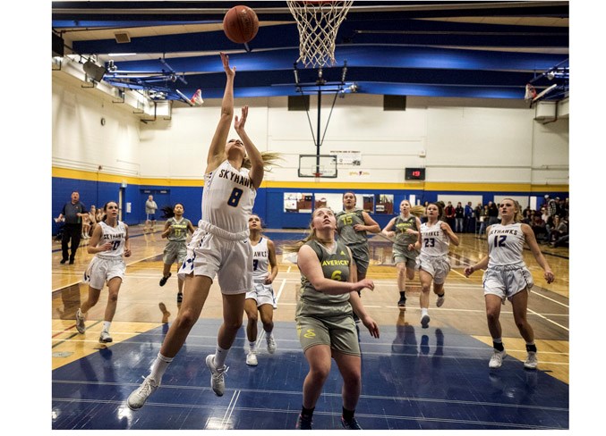 PROVINCIAL HOOPS – Kyleigh Kornak makes a basket against the Charles Spencer Mavericks of  Grande Prairie in Thursday’s opening game for the No. 1-ranked St. Albert Skyhawks at the 4A provincial high school women’s tournament. In the round of 16, the Skyhawks crushed No. 16 Mavericks 92-29 at the SkyDome and in the quarter-finals the two-time defending metro Edmonton division one champions buried the St. Mary’s Saints of Calgary 78-27 at Jasper Place. Friday’s semifinal result against the No. 4 Jasper Place Rebels determined if the Skyhawks play the No. 2 Bishop Carroll Cardinals of Calgary or the No. 3 Western Canada Redhawks of Calgary in today’s 2 p.m. bronze-medal match or 6 p.m. championship final at Jasper Place. The Skyhawks were winners of 20 in a row and 28-5 overall going into the semifinal. The score was unavailable at press time. Visit www.asaa.ca for results.
DAN RIEDLHUBER/St. Albert Gazette