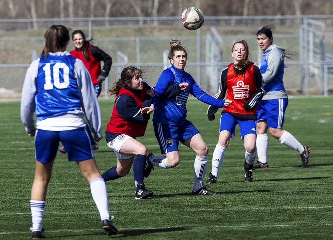 HEADS UP – Ally Bodner, right, Kelsey Carter and Madison Gamache converge on the ball as Samantha Bourbonnais (10) looks on during the St. Albert Impact women’s tryouts Sunday at Larry Olexiuk Field. The Impact women’s program added a division two team into the fold in the Edmonton District Soccer Association outdoor season, joining three premier teams that includes the Impact 1 (Spaidal) silver medallists at the 2018 provincials, plus the Tier 1 gold-medal winning Impact 4 (Murphy) team in division 1A. 
CHRIS COLBOURNE/St. Albert Gazette