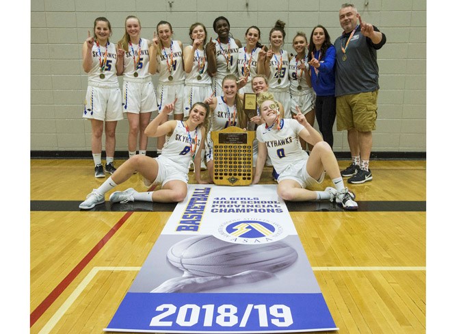 NUMBER ONE IN ALBERTA – The St. Albert Skyhawks were the best of the best this season as the 4A provincial high school women’s basketball champions. The Skyhawks finished 30-5 overall after defeating the No. 2-ranked Bishop Carroll Cardinals of Calgary 66-65 in Saturday‘s final at Jasper Place. The Skyhawks trailed 65-64 when Mimi Sigue hit two clutch free throws with 25.4 seconds remaining for the victory. The win was also the 22nd in a row for the back-to-back metro Edmonton division one champions. The lineup of six Grade 10s, three Grade 11s and three Grade 12s included six returnees from last year’s 29-7 provincial bronze medallists.
CHRIS COLBOURNE/St. Albert Gazette