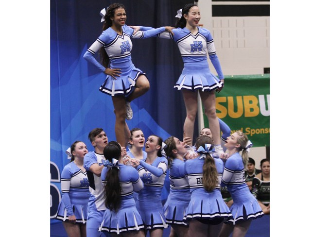 TEAM EFFORT – Serena Soares, left, and Kayle Mak of the Paul Kane Blues are supported by teammates on the braced liberty high to low pyramid move at the Alberta Schools’ Athletic Association cheerleading championships last weekend at Airdrie. Paul Kane was awarded silver in the game day division and placed fifth in the co-ed division.
SCOTT STRASSER/Airdrie City View