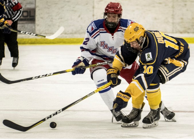 RETRIEVAL – Jaxon Dube of the St. Albert Nektar Raiders attempts to gather the puck in front of Daniel Keys of the Fort Saskatchewan Rangers in the north division final in the Alberta Midget AAA Hockey League. The Raiders battled back from two overtime losses to win the best-of-five series for a berth in the AMHL provincial final. Game one was played Friday in Calgary and the score was unavailable at press time. Game two is 3 p.m. Sunday at Akinsdale Arena and game three is 7:30 p.m. Tuesday at Cardel Rec South Arena. 
DAN RIEDLHUBER/St. Albert Gazette