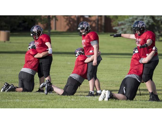 LINE DRILL – Players of the Bellerose Bulldogs work out at Wednesday's training camp at Bellerose Composite High School. The season opener for the Bulldogs in the division one Carr conference of the metro Edmonton league is Sept. 6 against the defending champion Harry Ainlay Titans at 5 p.m. at Foote Field. 
JOHN LUCAS/St. Albert Gazette