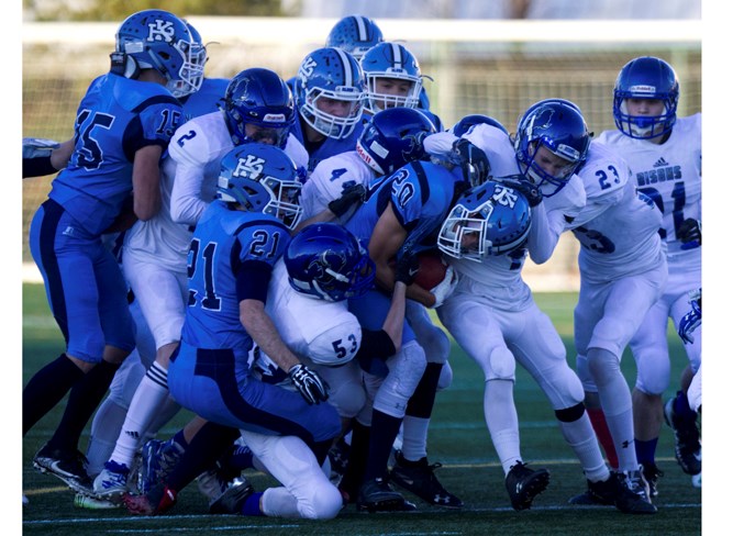 CENTRE OF ATTENTION – Ball carrier Daniel Mercado of the Paul Kane Blues attracts a crowd in Thursday's division two Miles conference semifinal against the Ardrossan Bisons at Clarke Stadium. Mercado's 95-yard pick-six with 1:39 left in the second quarter was the play of the game as Paul Kane ended the first half leading 30-14. The 53-14 win sends Paul Kane into Friday's final against the Sturgeon Spirits or Leduc Tigers and kickoff is 7:30 p.m. at Commonwealth Stadium.
CHRIS COLBOURNE/St. Albert Gazette