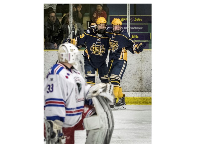 TEAMING UP – Mathieu Gautier, left, and Noah Kramps celebrate a goal by Kramps as netminder Garin Bjorklund of the Calgary Buffaloes looks on in game two of the Alberta Midget AAA Hockey League final Sunday at Akinsdale Arena. Kramps tallied twice in the second period and his short-handed effort made it 3-2 for the Raiders. The Buffaloes prevailed 4-3 with a short-handed effort in double overtime after winning the series opener 3-2 Friday in Calgary on a penalty shot in OT. Game three was played Tuesday in Calgary and the score was unavailable at press time. 
DAN RIEDLHUBER/St. Albert Gazette