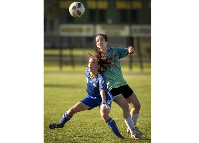 CHALLENGE PLAY – Julia McDougall of the St. Albert Impact 5 team and Juliana Vukovic of Rio Terrace FC vie for the ball in Thursday's division 2A match in the Edmonton District Soccer Association at Coronation Park. The Impact's first loss of the season was 6-4 as Rio Terrace (9-2-1) jumped ahead of the Impact (8-1-2) and Sherwood Park Phoenix 3 (8-1-1) for top spot in the table. Julia McDougall scored twice for a team-high 10 goals and youth trialist Morgen Bennett also potted a pair. Sunday the Impact plays Dreadnought 2 (5-3-2) at at 7 p.m. at Strathcona Athletic Park.
DAN RIEDLHUBER/St. Albert Gazette