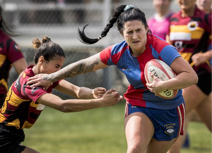 UNSTOPPABLE – Brie Gray slips a tackle en route to scoring one of her four tries in the first half against the Nor'Westers in Saturday's Alberta premier women's match at Ellerslie Rugby Park. Gray, the team's MVP last year, set the tone early in the second victory of the season with three tries in the opening 12 minutes of the 105-0 drubbing. 
DAN RIEDLHUBER/St. Albert Gazette