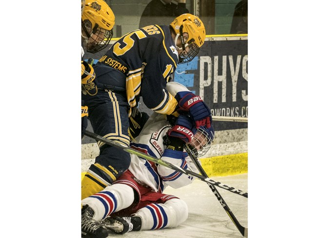 STRONG-ARMED – Erik Boers, captain of the St. Albert Nektar Raiders, roughs up Jack Zayat of the Calgary Buffaloes in the Alberta Midget AAA Hockey League provincial final. The Buffaloes swept the top north division team in the best-of-five series in Tuesday’s 7-4 decision in Calgary.
DAN RIEDLHUBER/St. Albert Gazette

