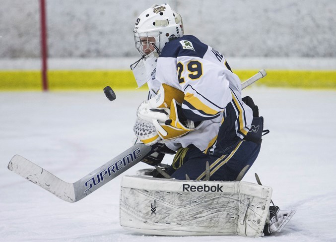 SHOT STOPPER – Evan Hergott blocks the puck for the St. Albert Source for Sports Crusaders, the No. 1-ranked team in the Northern Alberta Midget AA Hockey League at 26-4-2 in the regular season and 7-0-1 in the playoffs. The Hockey Alberta provincials start 1:45 p.m. Thursday for the Crusaders against the Camrose Vikings at The Meadows Community Recreation Centre. The Crusaders and Vikings will also face off in the best-of-five NAMHL final and the series opener is April 4 at 8:15 p.m. at Akinsdale Arena. The Crusaders are the defending league champions.
CHRIS COLBOURNE/St. Albert Gazette