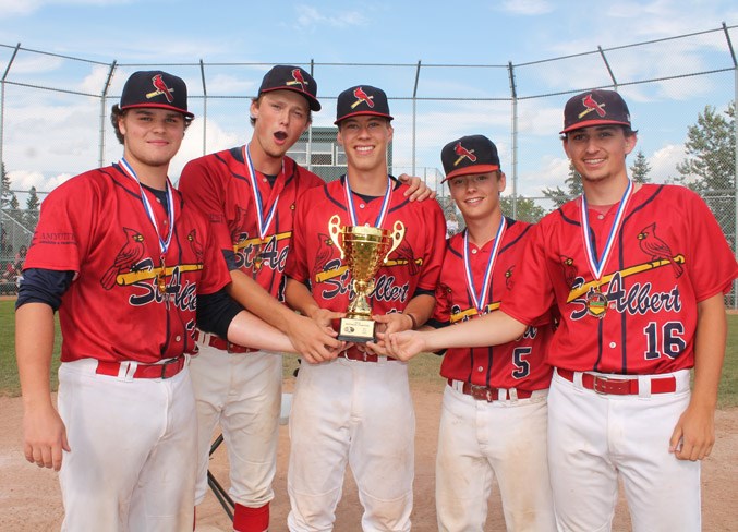 CUP HOLDERS – Liam Froment, left, Ryan Marples, Mike Brisson, Evan Bourassa and Brady Kobitowich of the St. Albert Cardinals show off the Baseball Alberta 18U AAA TIer I championship trophy during Sunday's post-game ceremony at Centennial Park in Sherwood Park. The Cardinals repeated by shutting out the Northern Lights of Grande Prairie 9-0 in the final to finish 5-0 at provincials.
JEFF HANSEN/St. Albert Gazette