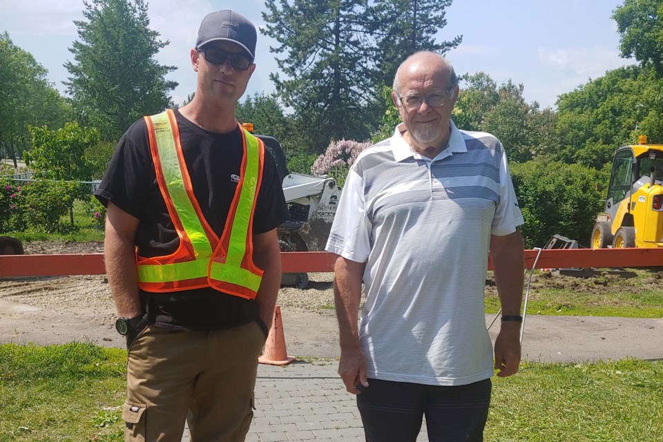 GTS Landscaping founder Craig Topilko (left) and Bruce Partington stand at the entrace of St. Albert Botanic Park's Memory Lane, now closed to the public for improvements. ANNA BOROWIECKI/St. Albert Gazette