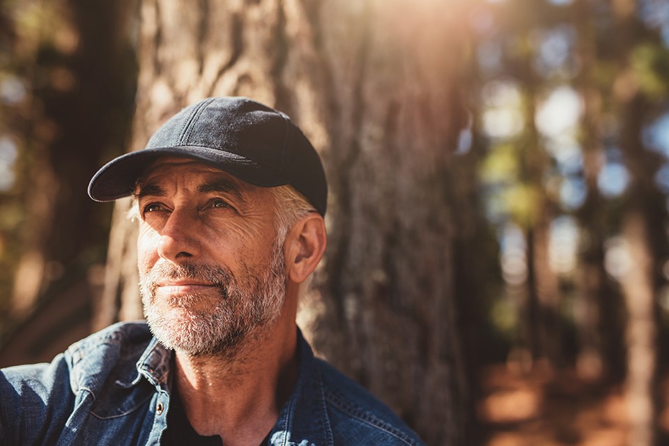 Outdoor-image--rugged-looking-man-with-a-jeans-jacket