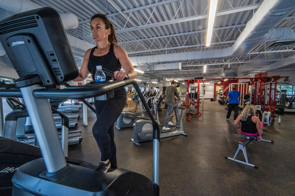 Sturgeon Valley Athletic Club member Jacqueline Kelly takes a turn on the stair machine at the newly reorganized fitness club in Campbell Business Park. The facility, which has seen many new renovations and upgrades is also complying with health protocols put in place due to COVID-19. CHRIS COLBOURNE/St. Albert Gazette