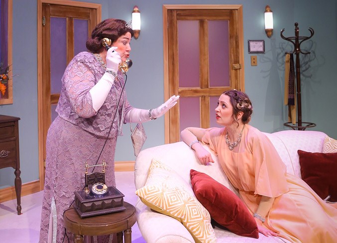 From left to right, St. Albert Children’s Theatre founding artistic director Maralyn Ryan (Julia) shares a dollop of gossip with St. Albert actress Madelaine Knight (Maggie) over the latest opera fiasco in Mayfield Dinner Theatre’s production of Lend Me a Tenor. 