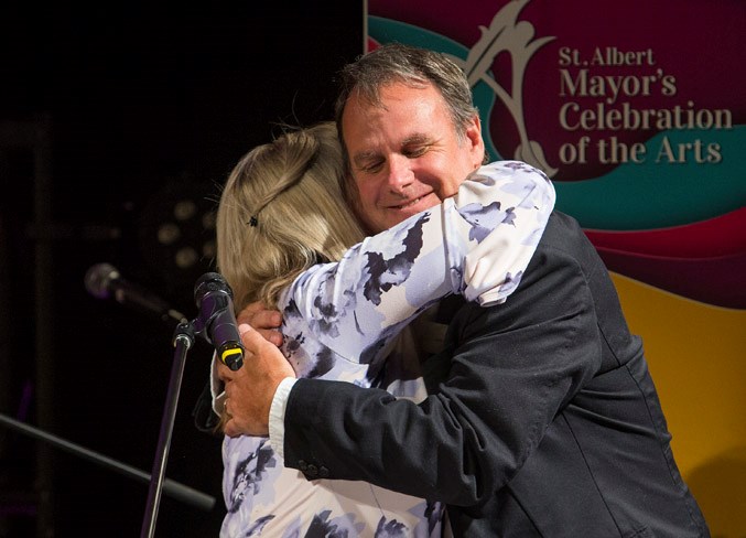 St. Albert Mayor Cathy Heron hugs local artist Lewis Lavoie, who received the Lifetime Achievement Award at the Mayor’s Celebration of the Arts Awards ceremony at the Enjoy Centre on Thursday evening.
CHRIS COLBOURNE/St. Albert Gazette