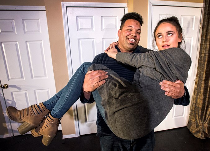 St. Albert Dinner Theatre member Maya Molly, as Jane, is carried by Colin Stewart, as Paul, in Barely Heirs, which opened Thursday at the Kinsmen Banquet Hall in St. Albert. Additional performances are set for tonight, April 18-20 and 25-27.
