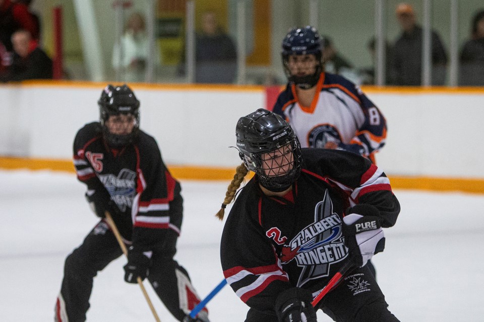 RINGING IT – Halle Nedohin of the U19AA St. Albert Mission attempts a shot as teammate Marley Belyea and Kennedy Rice of U19AA Zone 2 Blaze look on during action in the Black Gold League. The next game for the Mission is 6:45 p.m. Sunday against Spruce Grove at Go Auto Arena. 
CHRIS COLBOURNE/St. Albert Gazette