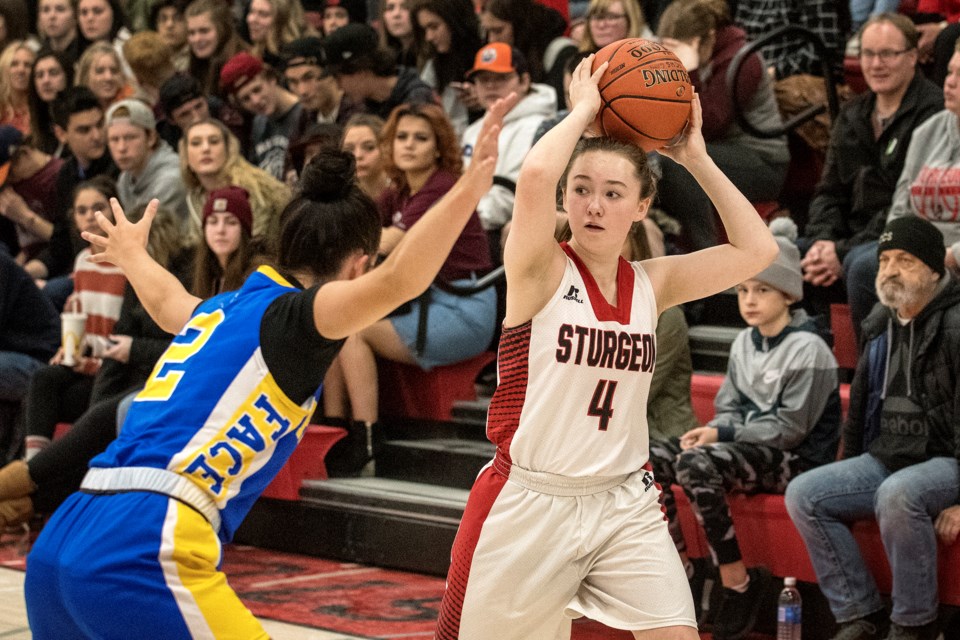 SEEKING SUPPORT – Cheyenne Brown of the Sturgeon Spirits looks for an open teammate against Raegan Tomkinson of the Bev Facey Falcons at the Rise Up tournament last month at Sturgeon Composite High School. Sturgeon is 2-2 in the metro Edmonton division two league after Monday's 75-60 loss against the Strathcona Christian Academy Eagles (3-1) at Sherwood Park. Tonight at 6:30 p.m. Sturgeon hosts the Memorial Marauders (0-4) of Stony Plain. Sturgeon is also the host team for the Alberta Schools' Athletic 3A provincial women's championship March 19 to 21.
DAN RIEDLHUBER/St. Albert Gazette