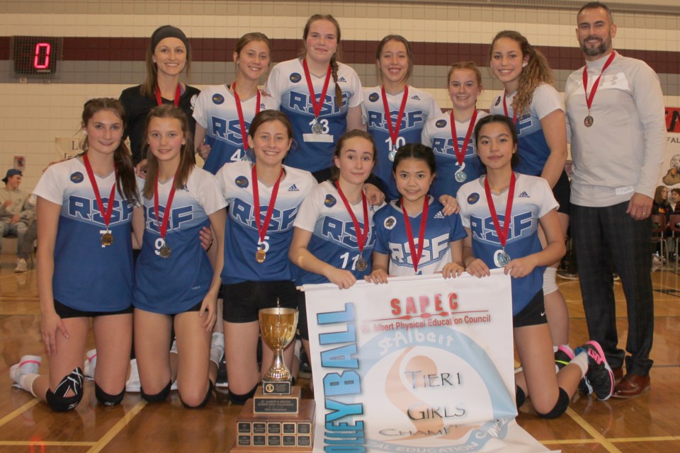 HISTORIC CHAMPIONSHIP – The first St. Albert Physical Education Council junior high female volleyball championship in school history was celebrated by the Richard S. Fowler Falcons in Thursday's Tier I city final against the Sir George Simpson Voyageurs. The Falcons finished 10-1 (30 GW/9 GL) in the SAPEC league with the 19-25, 25-19, 25-21, 26-24 victory against Simpson (10-1, 31 GW/7 GL), the three-time defending champion. In last year’s final, Simpson knocked off the undefeated Falcons in four sets. This year in league play Simpson swept the Falcons in three sets.
JEFF HANSEN/St. Albert Gazette