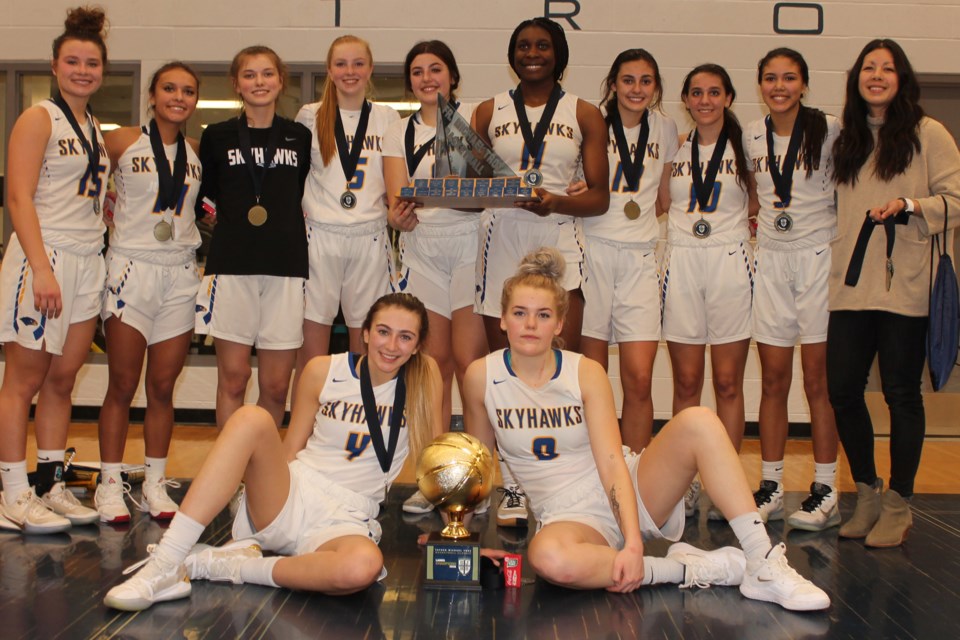 WINNERS – The fourth undefeated tournament weekend for the St. Albert Skyhawks was the 37th annual Father Michael Troy Basketball Classic at St. Joseph High School. Saturday's final was 86-39 for the defending 4A provincial champions against the Philles Girls of Marburg, Germany. The halftime score was 47-25. Dakota Wedman, a tournament all-star, and Teå DeMong sank 14 points apiece. Morgan Harris of the Skyhawks was named the tournament MVP. The Skyhawks are 14-1 in five tournaments and 8-0 in the metro Edmonton division one league after Monday's 77-38 win against the host O'Leary Spartans (4-3). Today at 5:30 p.m. the division one champions the last two years host the Harry Ainlay Titans (3-5) at the SkyDome in the last home game before the March 2 quarter-finals. 
JEFF HANSEN/St. Albert Gazette