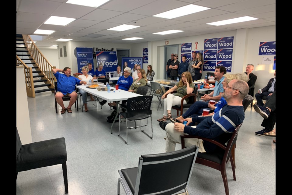 The UCP's Angela Wood's team gathers at her campaign office in Riel Park on Monday night as they wait for election results to roll in. 