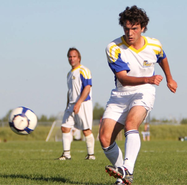 Sal Camminitore of the St. Albert Impact Rangers kicks the ball ahead during Thursday&#8217;s game against Africana FC. The 4-4 draw means the Rangers only have two games