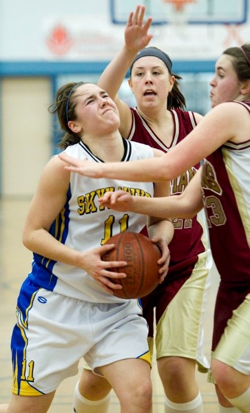 Paige Knull of the St. Albert Skyhawks struggles with the ball against the O&#8217;Leary defenders during the first half of Thursday&#8217;s metro Edmonton premier conference 