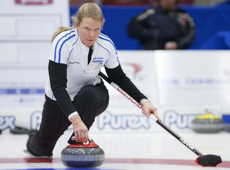 German skip Andrea Schopp slides out of the hack for Team World during Thursday&#8217;s opening draw at the World Financial Group Continental Cup of Curling. The 2010 world