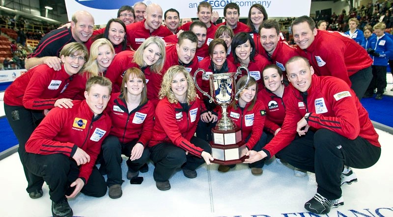 Team North America celebrates with a group picture after winning the seventh annual World Financial Group Continental Cup of Curling at Servus Credit Union Place. The first