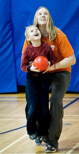 Keenoshayo teacher Chelsea Stone helps one of her Grade 1 students Tyler Heise