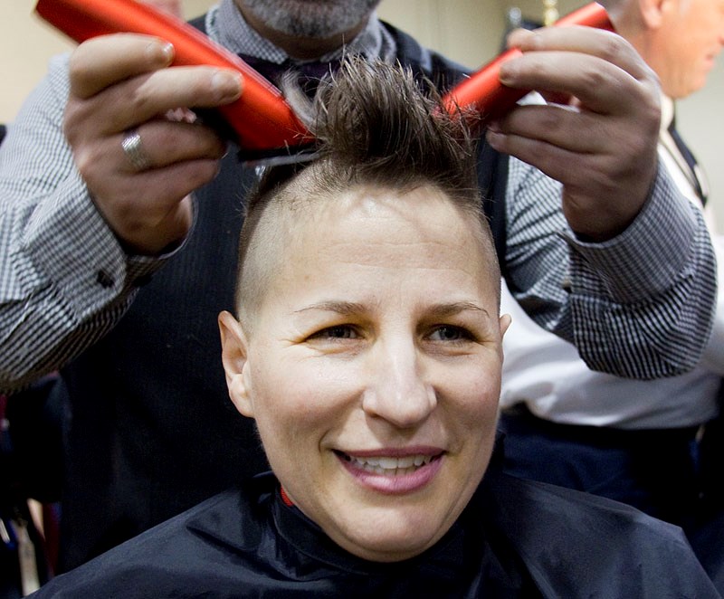 St. Albert RCMP Const. Janice Schoepp gets her temporary Mohawk buzzed for charity on Monday for the force&#8217;s Kids with Cancer fundraiser.
