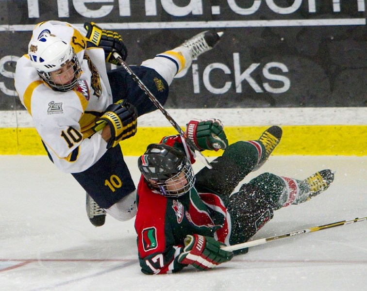 St. Albert Sabres forward Tyler Mrkonjic collides with defenceman Chase Torontow of the SSAC Southgate Lions while attempting a wraparound during third period action in