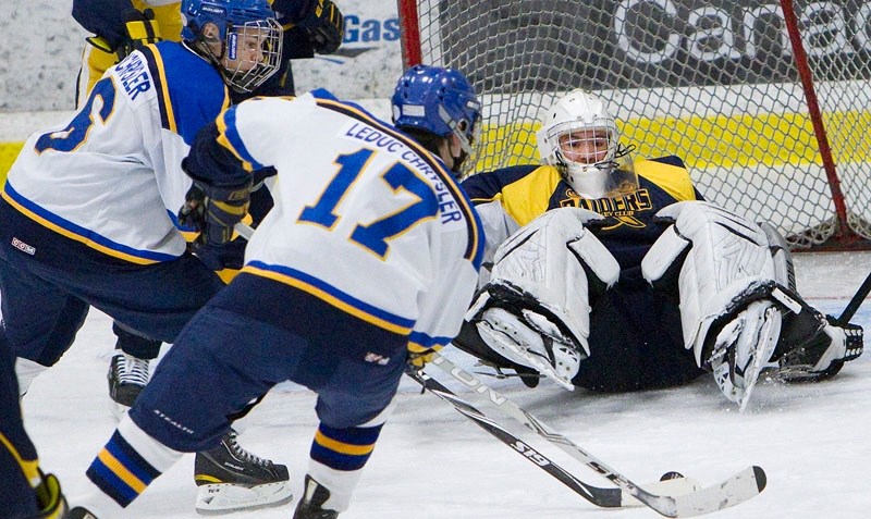 The Leduc Oil Kings buzz the net against St. Albert Raiders&#8217; goalie Wyatt Hoflin in the fifth and deciding game in the midget AAA north division semifinal Thursday at