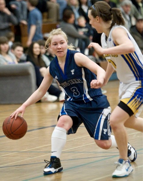 Melissa Woolley of the Paul Kane Blues eyes up an opening while guarded by Hayley Warmington of the St. Albert Skyhawks in Wednesday&#8217;s metro Edmonton premier semifinal