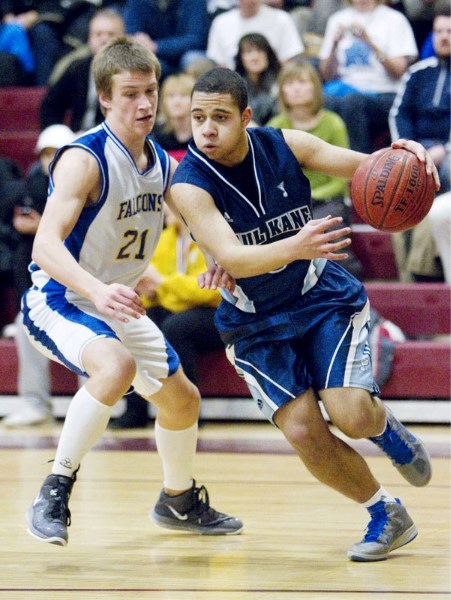 Harrison Laforest of the Paul Kane Blues goes around Sean Haliburton of the Bev Facey Falcons in the metro Edmonton premier junior men&#8217;s final Saturday at O&#8217;Leary 