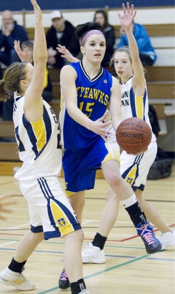 Kendall Lydon of the St. Albert Skyhawks splits the defence against the Edmonton Christian Lions for a basket in the first half in Thursday&#8217;s 3A Edmonton zone final.