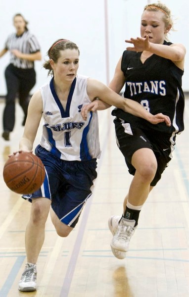 Jenny Howe of the Paul Kane Blues motors down the floor in the second half of Wednesday&#8217;s 63-57 loss to the Harry Ainlay Titans in the 4A Edmonton zone playdown