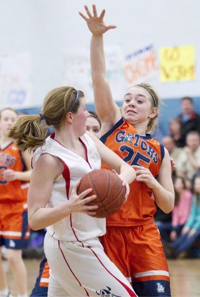 Katie Fitzgerald of the Lorne Akins Gators covers Kayla Ivicak like a blanket during the SAPEC tier 1 basketball final Friday at the SkyDome. The Gators defeated the Vincent