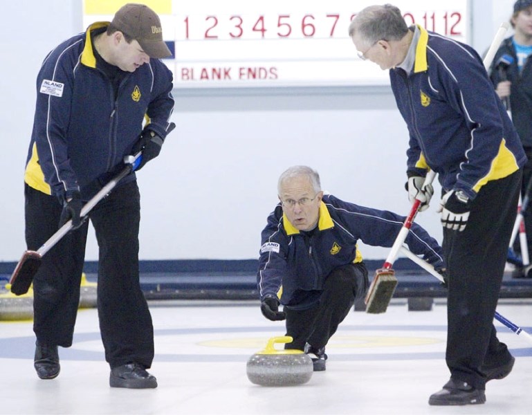 Brian Pfeifer guns a rock for sweepers Jamie King (left) and Ralph Killips in Sunday&#8217;s opening draw against Greg Albert in the President&#8217;s Cup playdowns at the