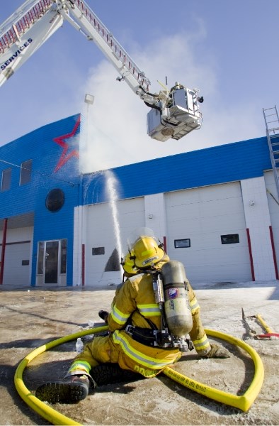 St. Albert Fire Department were on scene Friday afternoon after a roof collapsed starting a small stubborn fire at Carstar Quality Collision Service on Riel Drive. The
