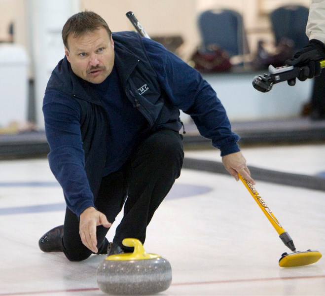 Warren Sadoway delivers a shot during the President&#8217;s Cup final Sunday night at the St. Albert Curling Club. Sadoway&#8217;s rink lost the sudden-death playoff 6-3 to