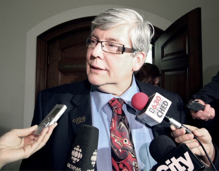 Education Minister Dave Hancock holds court with reporters after a meeting with Greater St. Albert Catholic school trustees on the lack of secular education options in