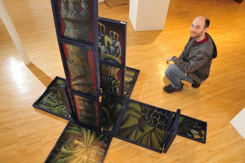 Artist Byron McBride with his work The Garden Polyptych