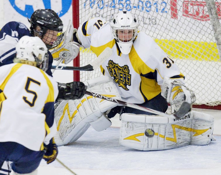 St. Albert Blues&#8217; netminder Max Cathcart keeps his eyes on the puck in game three of the best-of-five Northern Alberta Midget AA Hockey League final against the NE