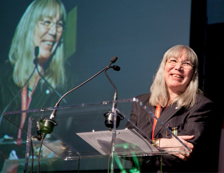 Visual artist Jane Ash Poitras addressed the assembled crowd after receiving her award at the Lieutenant Governor of Alberta Distinguished Artist Awards at the Enjoy Centre