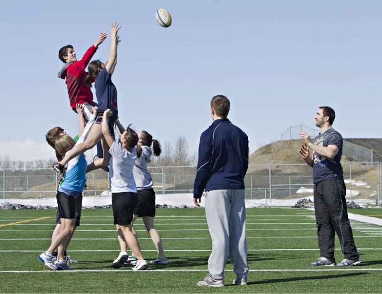 Avtar Mandahar and Annie Boyd from the Lorne Akins Gators&#8217; co-ed flag rugby team challenge for a line-out ball from Brett Kelly during Wednesday&#8217;s rugby clinic at 