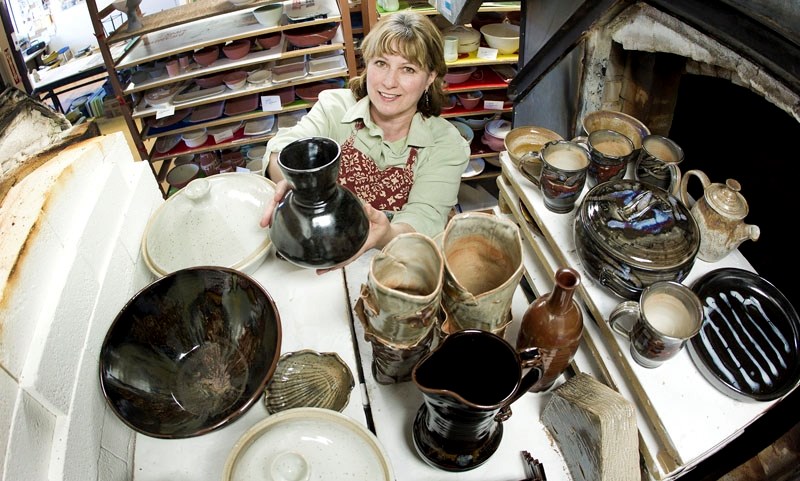Local Potter and ceramic artist Gina Joys helps get ready for the annual St. Albert Potters&#8217; Guild Spring Pottery Sale at St. Albert Place. running from Thursday
