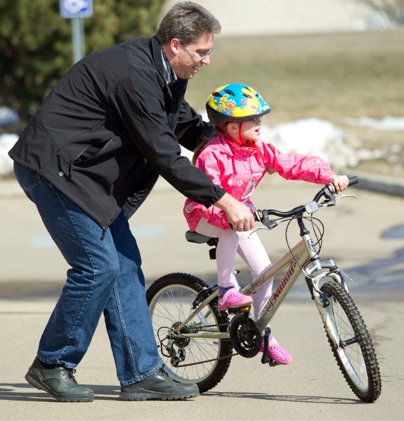 Rod Ward helps his daughter Keira